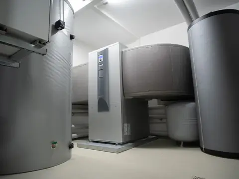 Tall tanks and equipment standing in a bright utility room