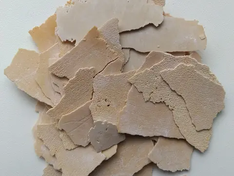 Flakes of limescale taken out of a kettle