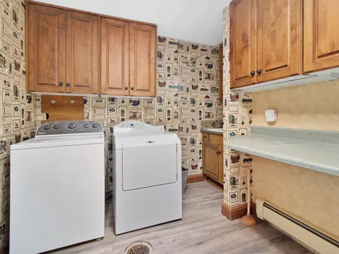 A laundry room with a washer and a dryer