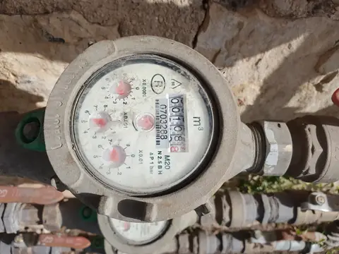 A water meter on a house's main water line